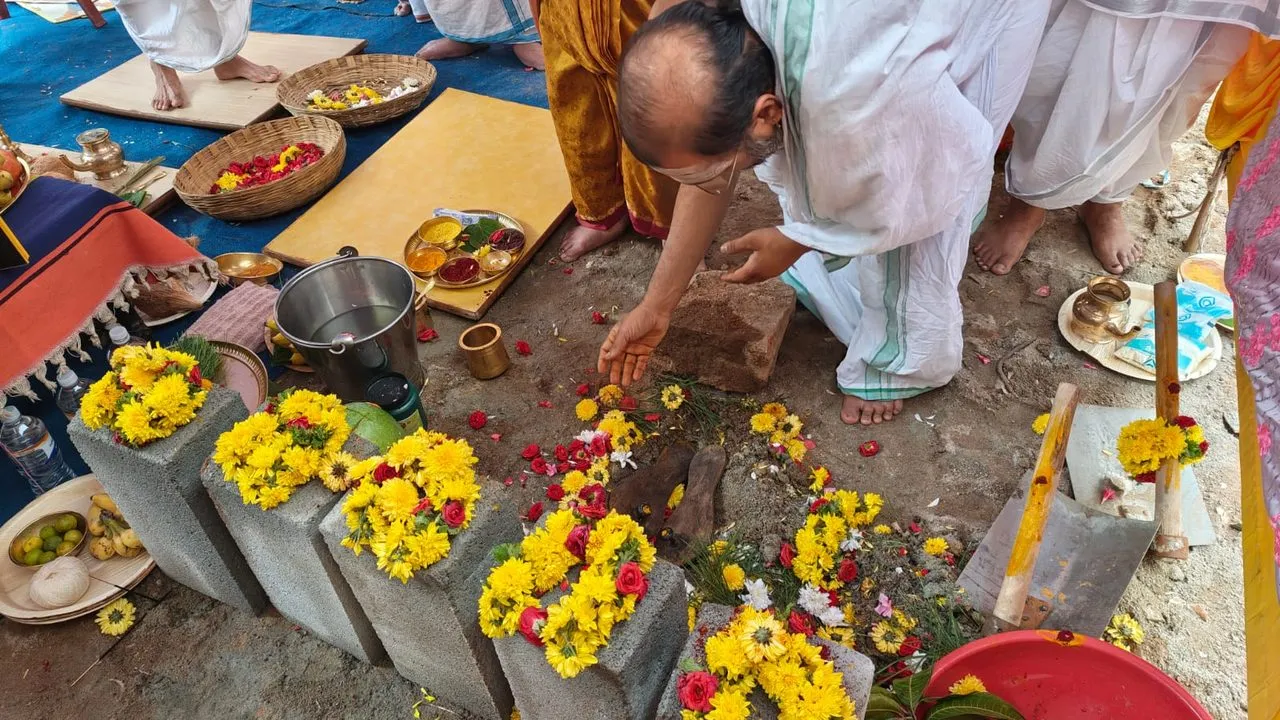 Offering flowers at the foundation